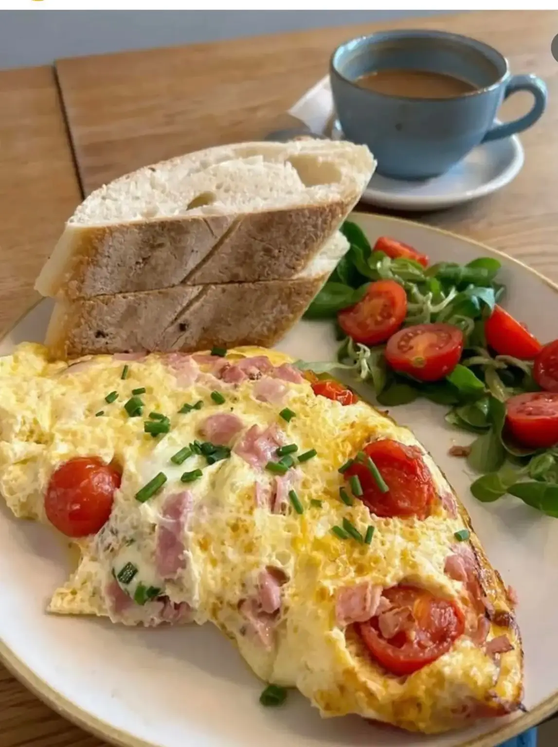 Breakfast with bread eggs and hot drink